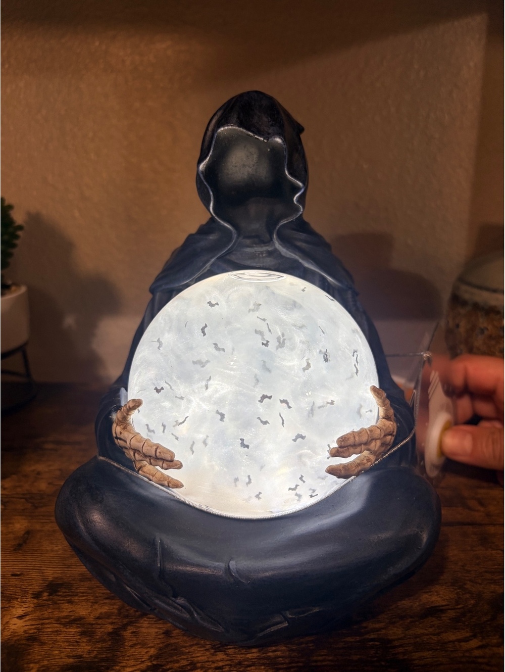 Grim Reaper Holding Crystal Ball with Bats Globe